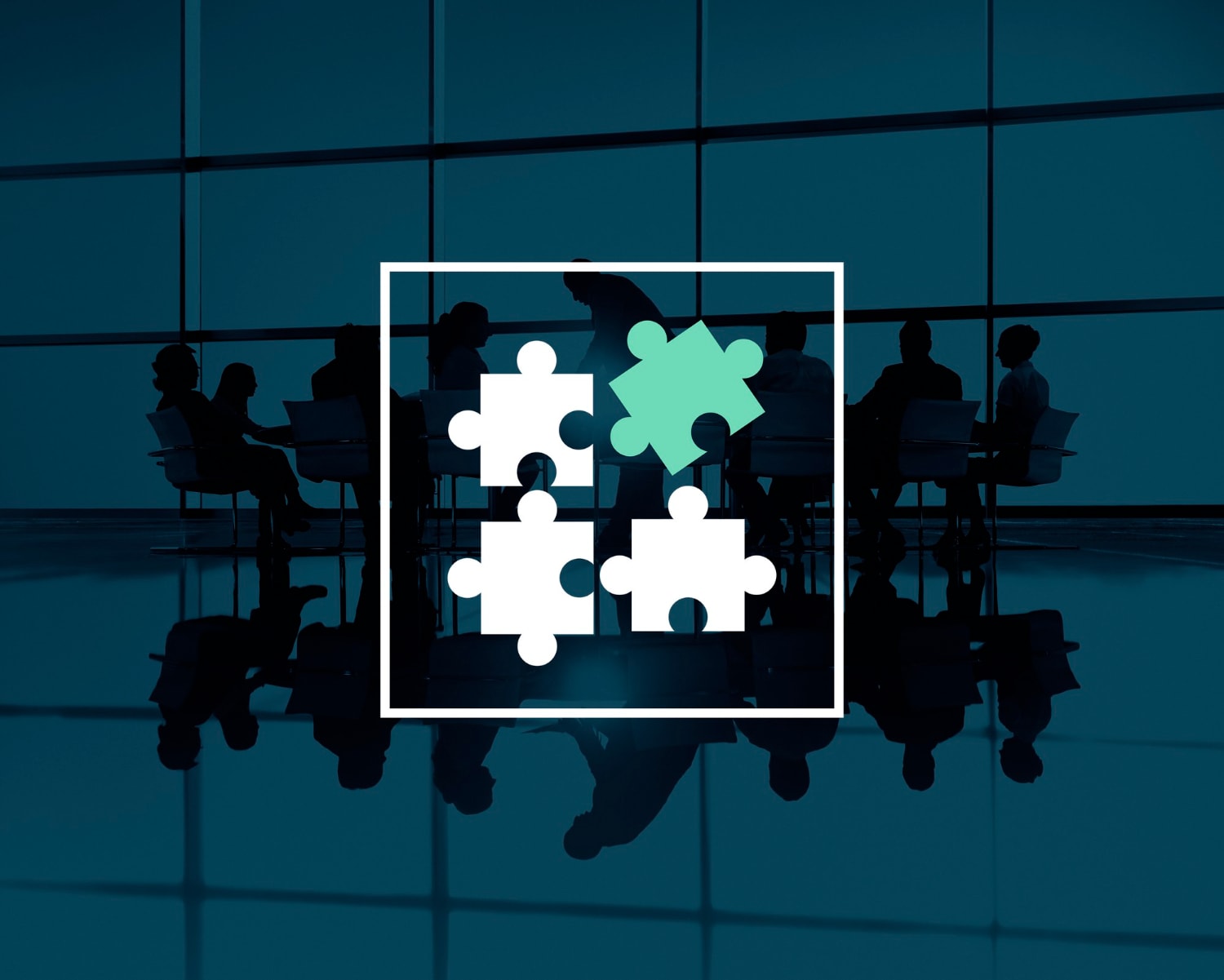Team silhouettes in a boardroom with a connecting puzzle-piece graphic